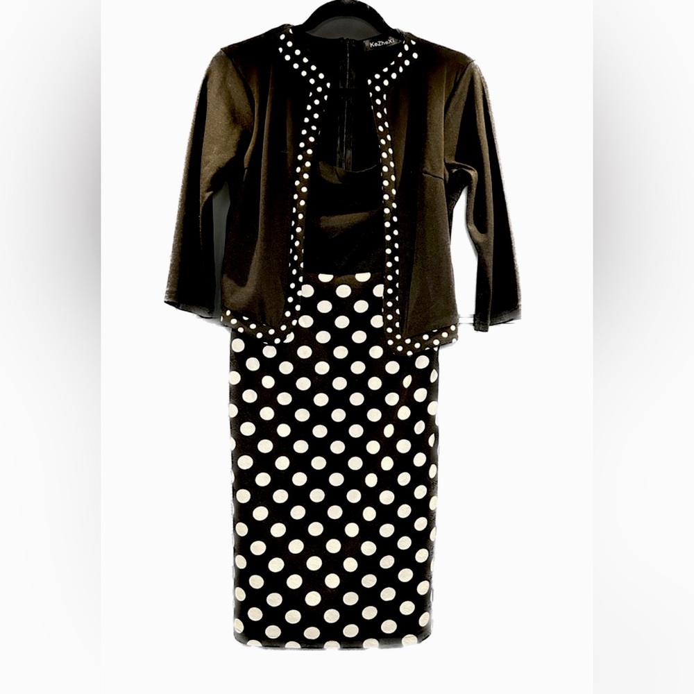 One piece black & white dress that has an attached cardigan. Polka dots!